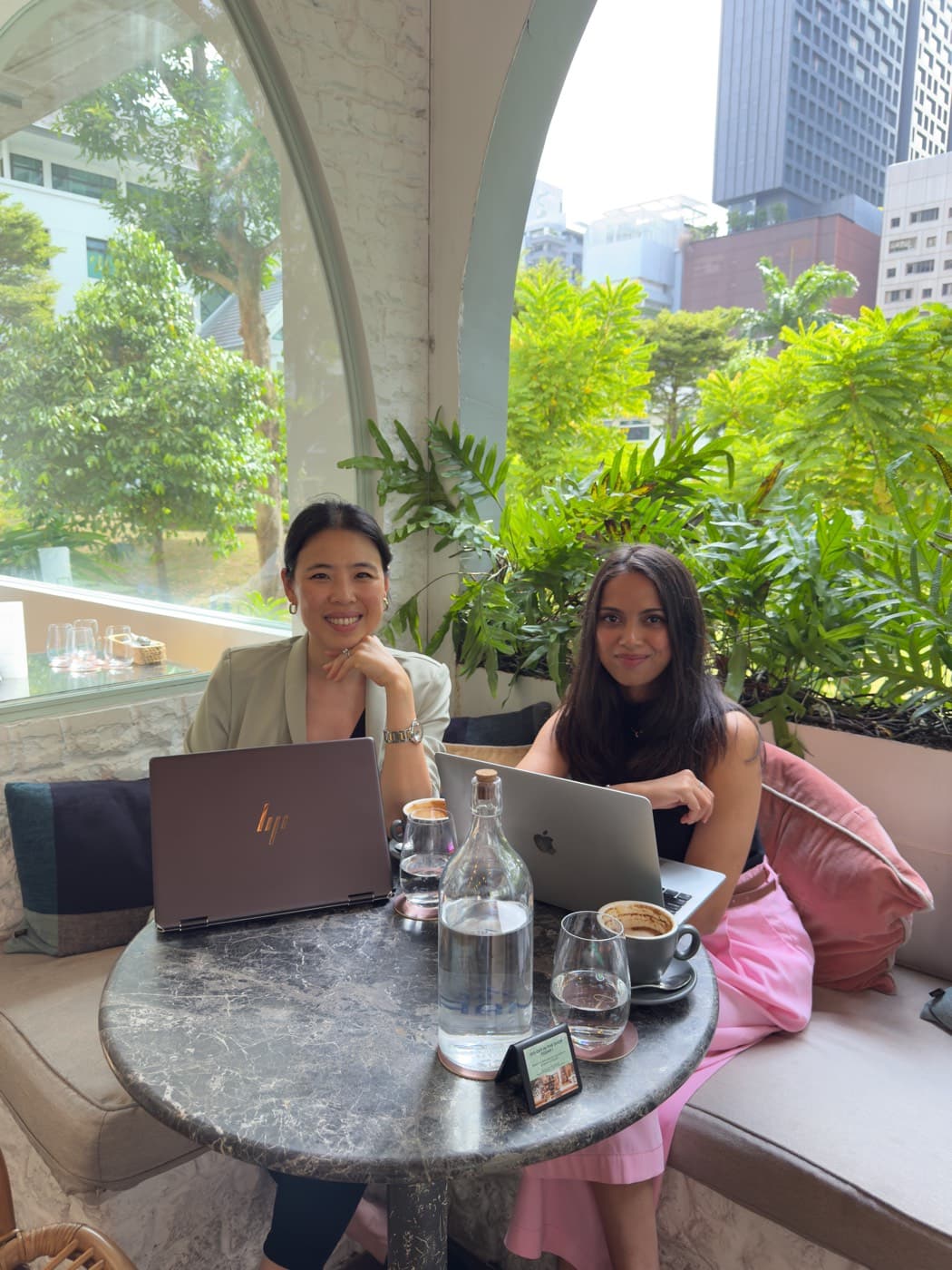 Pattern’s two co-founders working together at a cafe in Singapore